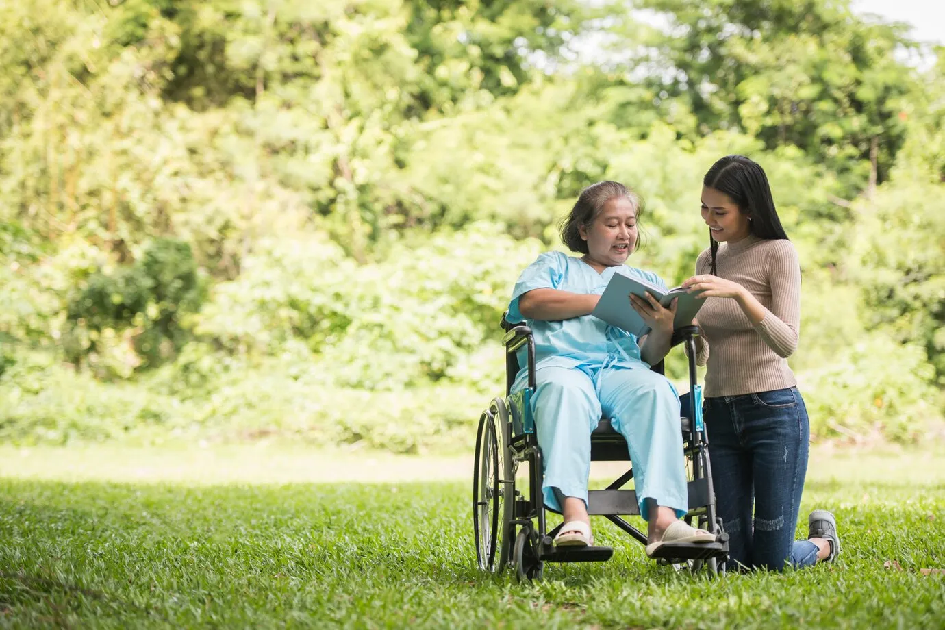 happy-woman-wheelchair-reading-b